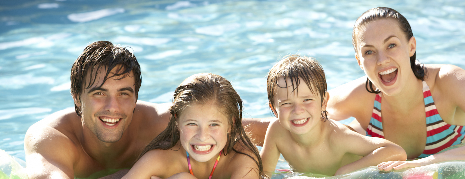 Beautiful backyard swimming pool with loungers