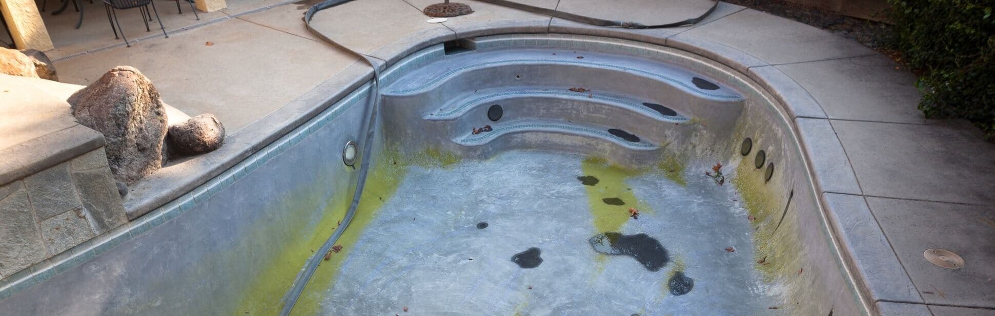 Pool repair technician working on pool equipment